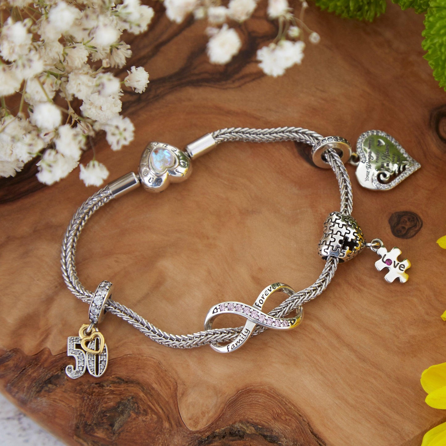 Puzzle Charm- 925 Sterling Silver, this unique Autism charm is in the shape of a heart with puzzle pieces printed into it.